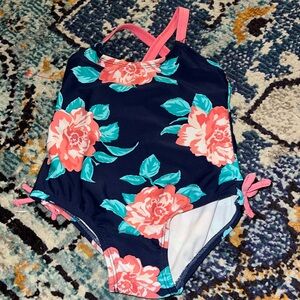 Carters Navy with pink floral one piece swim suit. 12 mo. VGUC.